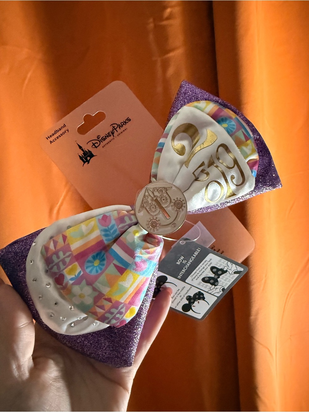 Disney Purple Glitter Bow Headband with Gold Medallion and Pastel Pattern
